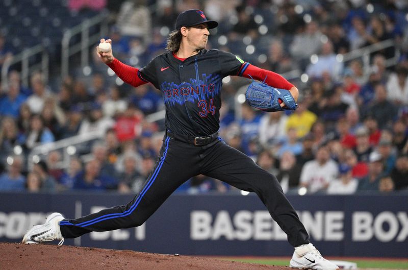 Sep 25, 2024; Toronto, Ontario, CAN;  Toronto Blue Jays starting pitcher Kevin Gausman (34) delivers a pitch against the Boston Red Sox in the first inning at Rogers Centre. Mandatory Credit: Dan Hamilton-Imagn Images