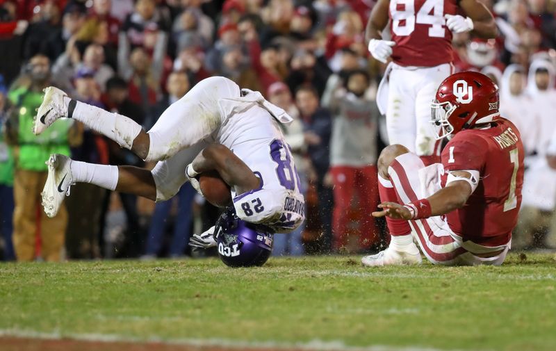 Nov 23, 2019; Norman, OK, USA; TCU Horned Frogs safety Nook Bradford (28) recovers a fumble from Oklahoma Sooners quarterback Jalen Hurts (1) during the fourth quarter at Gaylord Family - Oklahoma Memorial Stadium. Mandatory Credit: Kevin Jairaj-USA TODAY Sports