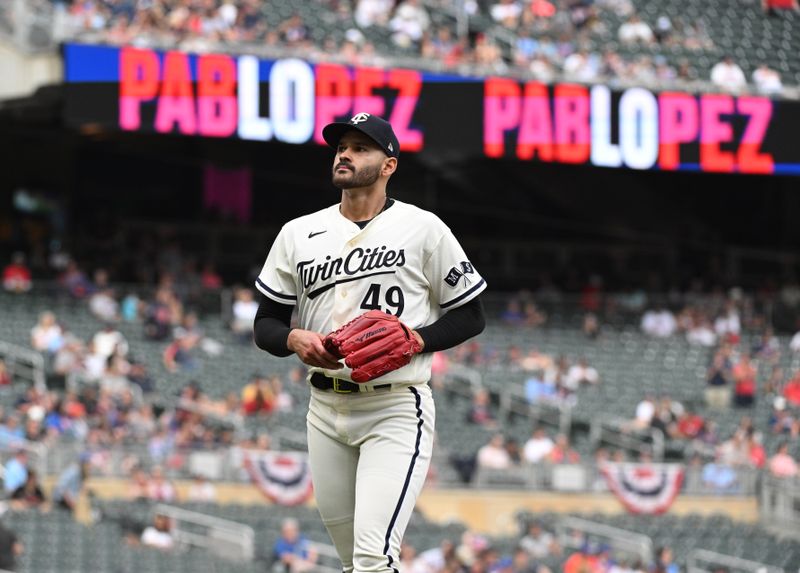 Sep 10, 2023; Minneapolis, Minnesota, USA; Minnesota Twins starting pitcher Pablo Lopez (49) walks off the field against the New York Mets in the seventh inning at Target Field. Mandatory Credit: Michael McLoone-USA TODAY Sports