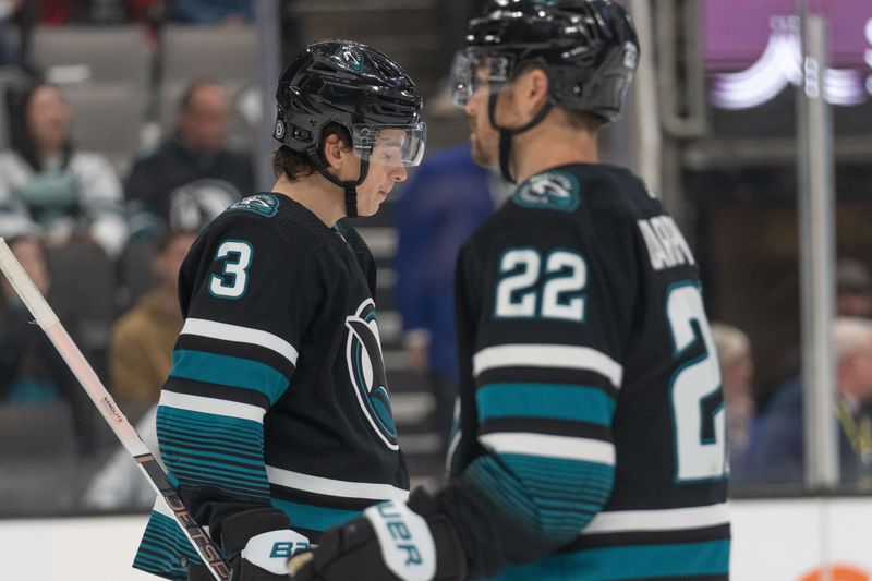 Feb 29, 2024; San Jose, California, USA; San Jose Sharks defenseman Henry Thrun (3) and center Ryan Carpenter (22) react after losing to the Anaheim Ducks at SAP Center at San Jose. Mandatory Credit: Stan Szeto-USA TODAY Sports