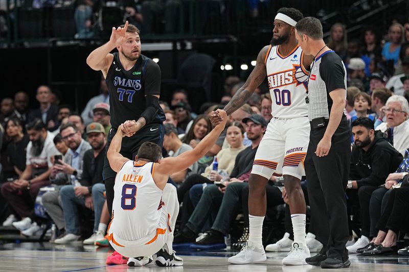 DALLAS, TX - FEBRUARY 22: Luka Doncic #77 of the Dallas Mavericks and Royce O'Neale of the Phoenix Suns help up Grayson Allen #8 during the game on February 22, 2024 at the American Airlines Center in Dallas, Texas. NOTE TO USER: User expressly acknowledges and agrees that, by downloading and or using this photograph, User is consenting to the terms and conditions of the Getty Images License Agreement. Mandatory Copyright Notice: Copyright 2024 NBAE (Photo by Glenn James/NBAE via Getty Images)