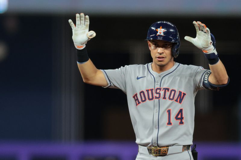 Aug 4, 2025; Miami, Florida, USA; Houston Astros pinch hitter Mauricio Dubon (14) reacts from second base after hitting an RBI double against the Miami Marlins during the eighth inning at loanDepot Park. Mandatory Credit: Sam Navarro-Imagn Images