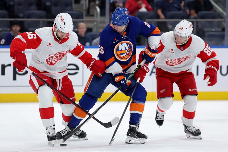 Oct 22, 2024; Elmont, New York, USA; New York Islanders right wing Oliver Wahlstrom (26) fights for the puck against Detroit Red Wings defenseman Erik Gustafsson (56) and right wing Patrick Kane (88) during the second period at UBS Arena. Mandatory Credit: Brad Penner-Imagn Images