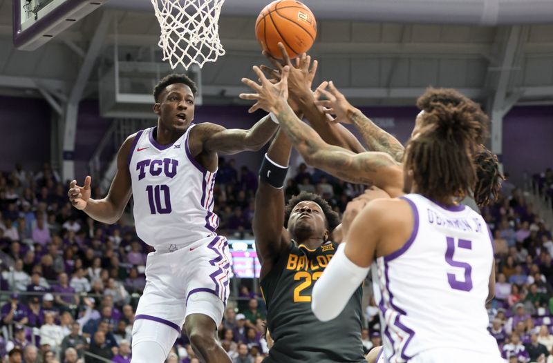 Feb 11, 2023; Fort Worth, Texas, USA;  TCU Horned Frogs guard Damion Baugh (10) and Baylor Bears forward Jonathan Tchamwa Tchatchoua (23) go for the ball during the first half at Ed and Rae Schollmaier Arena. Mandatory Credit: Kevin Jairaj-USA TODAY Sports