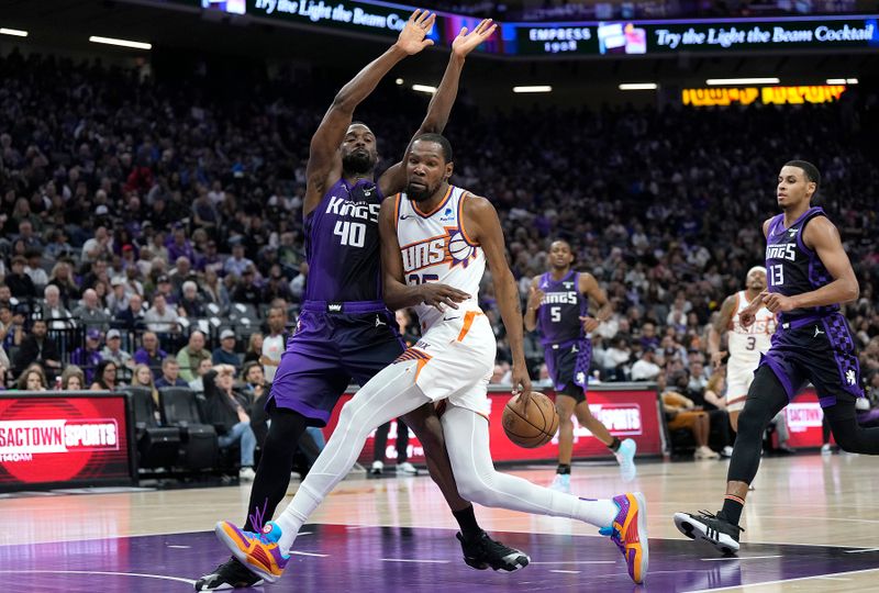 SACRAMENTO, CALIFORNIA - APRIL 12: Kevin Durant #35 of the Phoenix Suns loses control of the ball against Harrison Barnes #40 of the Sacramento Kings during the first half at Golden 1 Center on April 12, 2024 in Sacramento, California. NOTE TO USER: User expressly acknowledges and agrees that, by downloading and or using this photograph, User is consenting to the terms and conditions of the Getty Images License Agreement. (Photo by Thearon W. Henderson/Getty Images)