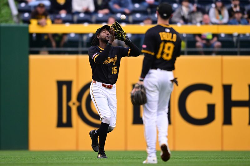 May 3, 2025; Pittsburgh, Pennsylvania, USA; Pittsburgh Pirates center fielder Oneil Cruz (15) catches a ball during the fourth inning against the San Diego Padres at PNC Park. Mandatory Credit: David Dermer-Imagn Images