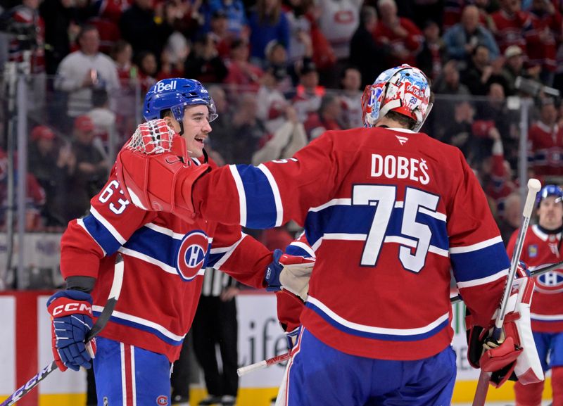 Nov 22, 2025; Montreal, Quebec, CAN; Montreal Canadiens forward Florian Xhekaj (63) and teammate goalie Jakub Dobes (75) celebrate the win against the Toronto Maple Leafs at the Bell Centre. Mandatory Credit: Eric Bolte-Imagn Images