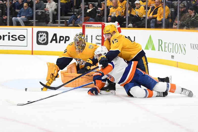 Jan 13, 2024; Nashville, Tennessee, USA; New York Islanders center Kyle Palmieri (21) loses the puck as he is defended by Nashville Predators defenseman Alexandre Carrier (45) during the second period at Bridgestone Arena. Mandatory Credit: Christopher Hanewinckel-USA TODAY Sports