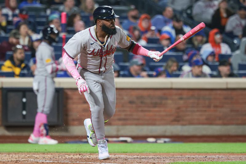 May 12, 2024; New York City, New York, USA; Atlanta Braves designated hitter Marcell Ozuna (20) hits an RBI single during the sixth inning against the New York Mets at Citi Field. Mandatory Credit: Vincent Carchietta-USA TODAY Sports