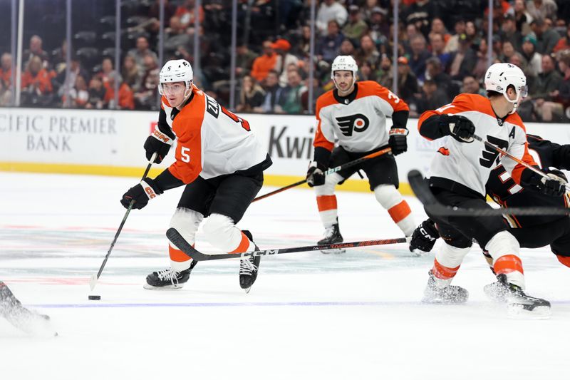 Nov 10, 2023; Anaheim, California, USA; Philadelphia Flyers defenseman Egor Zamula (5) controls the puck during the first period against the Anaheim Ducks at Honda Center. Mandatory Credit: Kiyoshi Mio-USA TODAY Sports