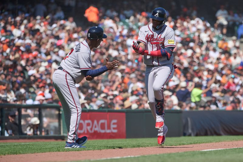 Aug 26, 2023; San Francisco, California, USA; Atlanta Braves infielder Orlando Arcia (11) shakes hands with third base coach Ron Washington (37) after hitting a solo home run against the San Francisco Giants during the sixth inning at Oracle Park. Mandatory Credit: Robert Edwards-USA TODAY Sports