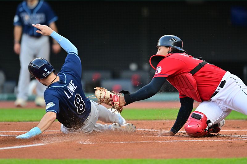 Sep 1, 2023; Cleveland, Ohio, USA; Tampa Bay Rays second baseman Brandon Lowe (8) scores as Cleveland Guardians catcher Bo Naylor (23) is late with the tag during the first inning at Progressive Field. Mandatory Credit: Ken Blaze-USA TODAY Sports