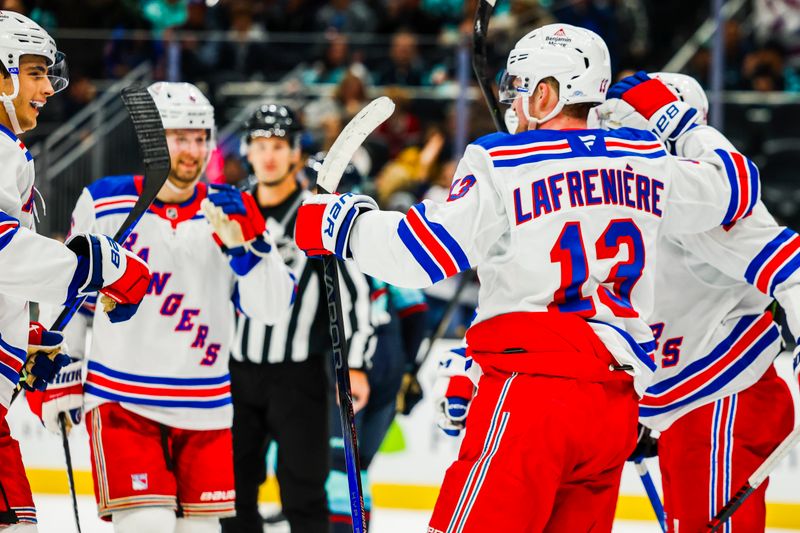 Nov 17, 2024; Seattle, Washington, USA; New York Rangers left wing Alexis Lafrenière (13) celebrates after scoring a goal against the Seattle Kraken during the second period at Climate Pledge Arena. Mandatory Credit: Joe Nicholson-Imagn Images