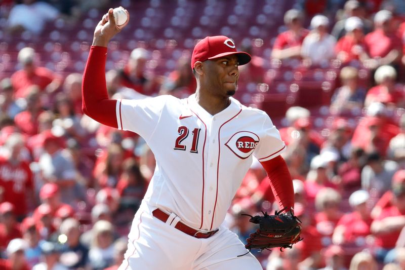 Sep 20, 2023; Cincinnati, Ohio, USA; Cincinnati Reds starting pitcher Hunter Greene (21) throws against the Minnesota Twins during the first inning at Great American Ball Park. Mandatory Credit: David Kohl-USA TODAY Sports