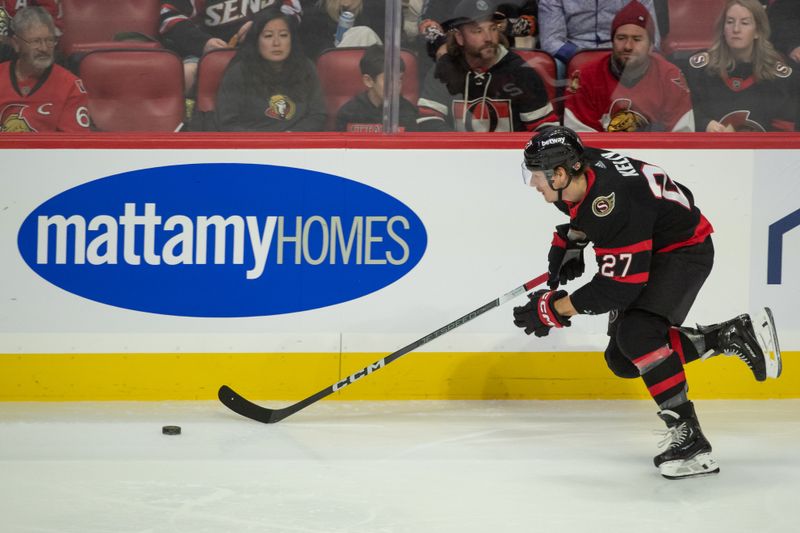 Nov 24 2023; Ottawa, Ontario, CAN; Ottawa Senators left wing Parker Kelly (27) skates with the puck in the third period against the New York Islanders at the Canadian Tire Centre. Mandatory Credit: Marc DesRosiers-USA TODAY Sports