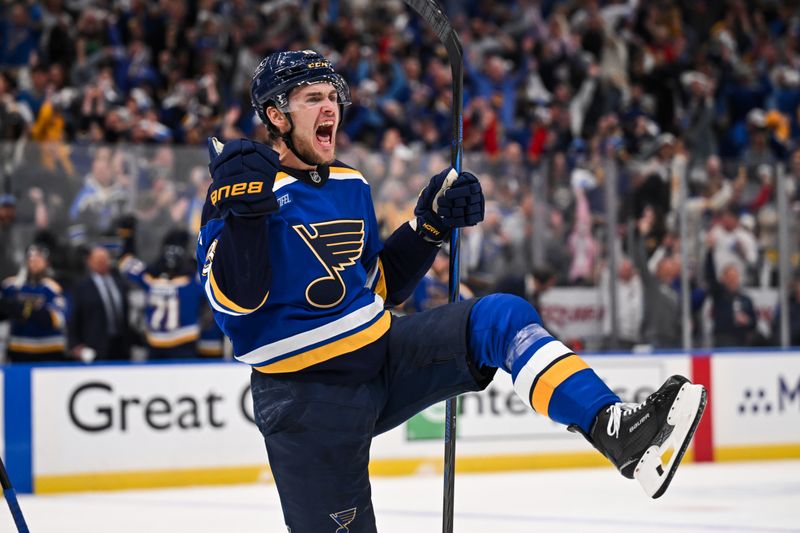 May 2, 2025; St. Louis, Missouri, USA; St. Louis Blues right wing Alexey Toropchenko (13) reacts after scoring a goal against the Winnipeg Jets during the second period in game six of the first round of the 2025 Stanley Cup Playoffs at Enterprise Center. Mandatory Credit: Connor Hamilton-Imagn Images