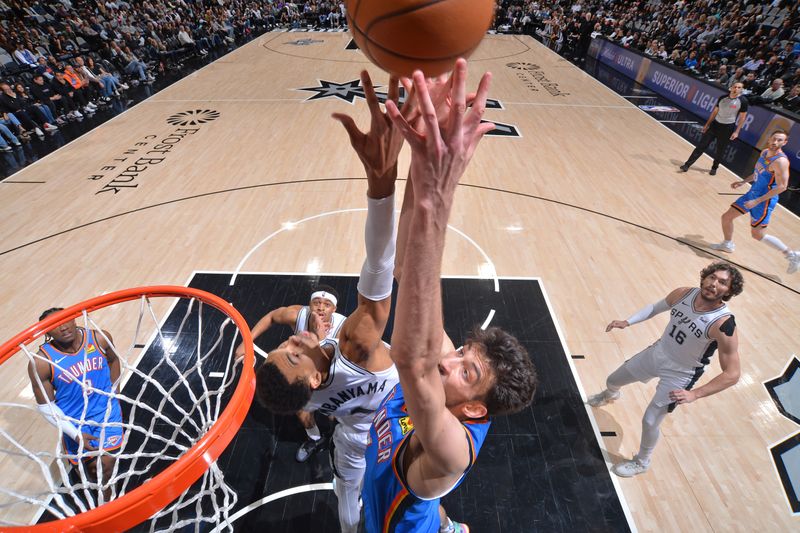 SAN ANTONIO, TX - FEBRUARY 29:  Chet Holmgren #7 of the Oklahoma City Thunder grabs a rebound during the game against the San Antonio Spurs on February 29, 2024 at the Frost Bank Center in San Antonio, Texas. NOTE TO USER: User expressly acknowledges and agrees that, by downloading and or using this photograph, user is consenting to the terms and conditions of the Getty Images License Agreement. Mandatory Copyright Notice: Copyright 2024 NBAE (Photos by Michael Gonzales/NBAE via Getty Images)