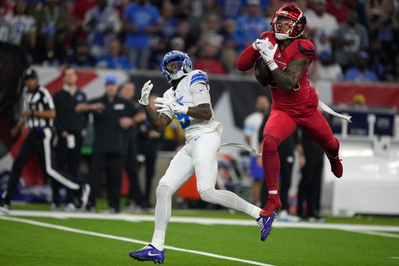 Houston Texans cornerback Derek Stingley Jr. breaks up a pass intended for Detroit Lions wide receiver Jameson Williams, left, during the first half of an NFL football game, Sunday, Nov. 10, 2024, in Houston. (AP Photo/Eric Christian Smith)