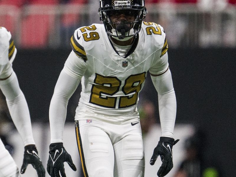 New Orleans Saints cornerback Paulson Adebo (29) works during the first half of an NFL football game against the Atlanta Falcons, Sunday, Nov. 26, 2023, in Atlanta. The Atlanta Falcons won 24-15. (AP Photo/Danny Karnik)