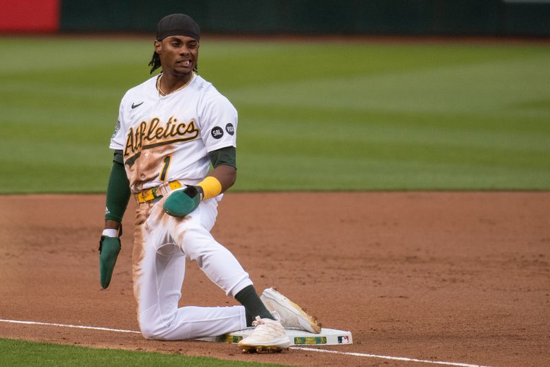 Jun 27, 2023; Oakland, California, USA; Oakland Athletics center fielder Esteury Ruiz (1) reacts after getting caught stealing third base during the third inning against the New York Yankees at Oakland-Alameda County Coliseum. Mandatory Credit: Ed Szczepanski-USA TODAY Sports