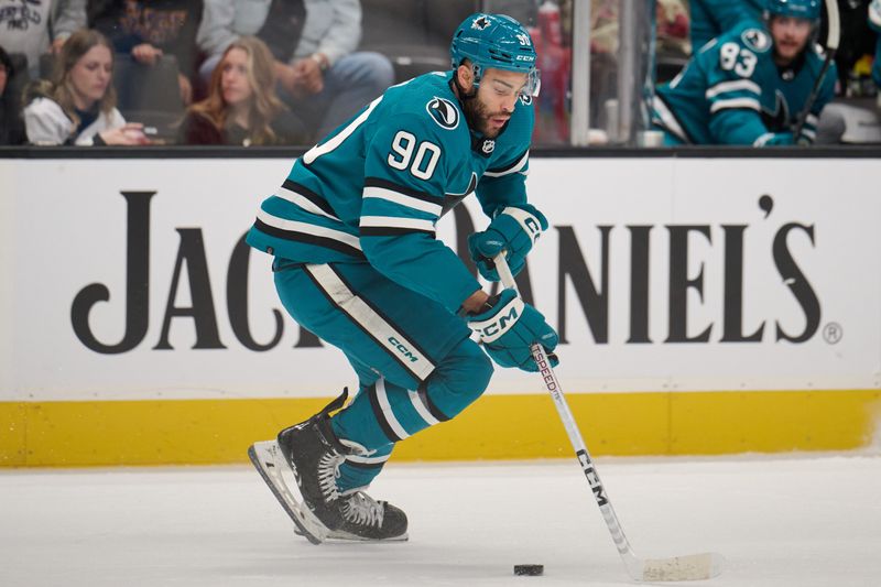 Dec 12, 2023; San Jose, California, USA; San Jose Sharks right wing Justin Bailey (90) skates with the puck against the Winnipeg Jets during the third period at SAP Center at San Jose. Mandatory Credit: Robert Edwards-USA TODAY Sports