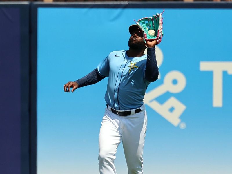  Mar 18, 2024; Port Charlotte, Florida, USA; Tampa Bay Rays outfielder Randy Arozarena (56)  catches a fly ball against the Atlanta Braves at Charlotte Sports Park. Mandatory Credit: Kim Klement Neitzel-USA TODAY Sports