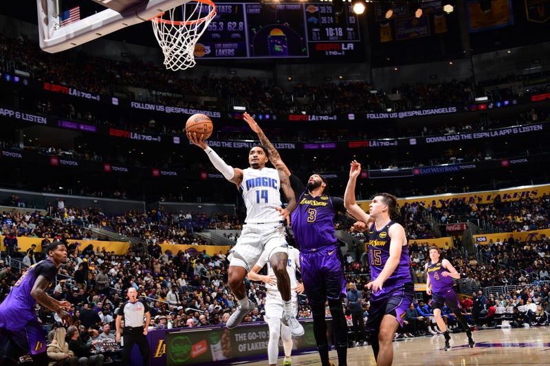 LOS ANGELES, CA - NOVEMBER 21: Gary Harris #14 of the Orlando Magic drives to the basket during the game against the Los Angeles Lakers on November 21, 2024 at Crypto.Com Arena in Los Angeles, California. NOTE TO USER: User expressly acknowledges and agrees that, by downloading and/or using this Photograph, user is consenting to the terms and conditions of the Getty Images License Agreement. Mandatory Copyright Notice: Copyright 2024 NBAE (Photo by Adam Pantozzi/NBAE via Getty Images)