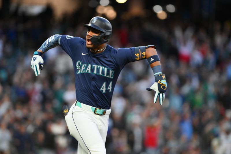 Jun 13, 2024; Seattle, Washington, USA; Seattle Mariners center fielder Julio Rodriguez (44) celebrates after hitting a home run against the Chicago White Sox during the ninth inning at T-Mobile Park. Mandatory Credit: Steven Bisig-USA TODAY Sports