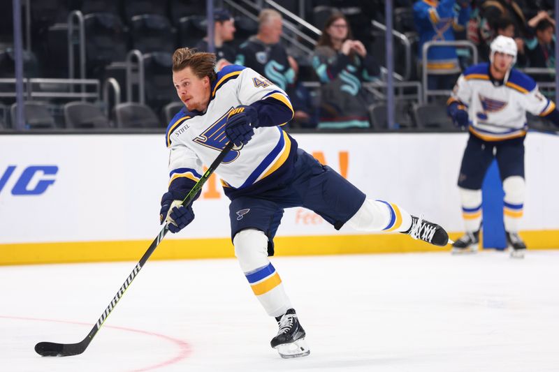 Oct 8, 2024; Seattle, Washington, USA; St. Louis Blues right wing Kasperi Kapanen (42) shoots during warm ups before the game against the Seattle Kraken at Climate Pledge Arena. Mandatory Credit: Caean Couto-Imagn Images