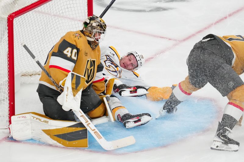 Dec 31, 2025; Las Vegas, Nevada, USA; Nashville Predators left wing Cole Smith (36) is tripped up by Vegas Golden Knights defenseman Ben Hutton (17) in front of goaltender Akira Schmid (40) on a break away during the third period at T-Mobile Arena. Mandatory Credit: Stephen R. Sylvanie-Imagn Images