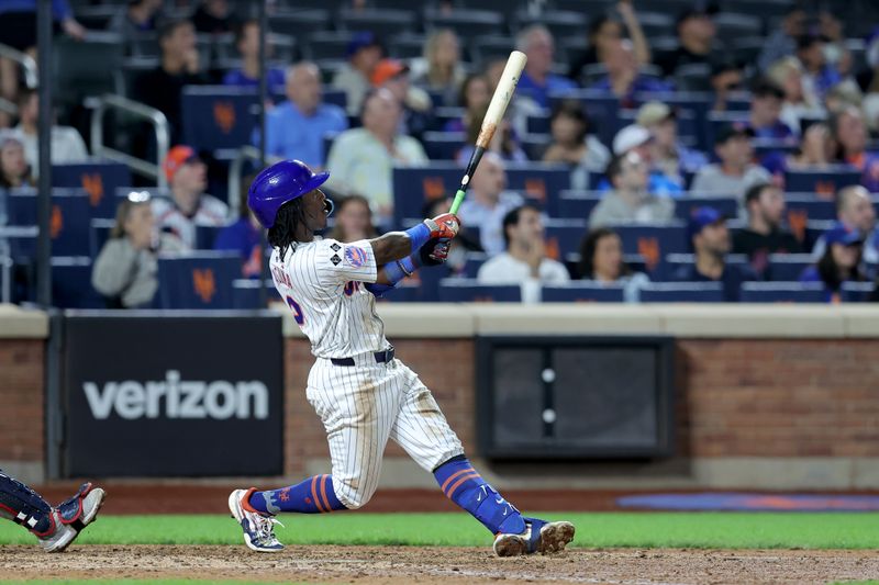 Sep 18, 2024; New York City, New York, USA; New York Mets shortstop Luisangel Acuna (2) follows through on a solo home run against the Washington Nationals during the eighth inning at Citi Field. Mandatory Credit: Brad Penner-Imagn Images