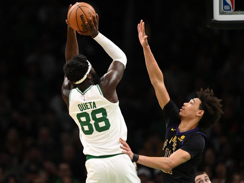 BOSTON, MASSACHUSETTS - FEBRUARY 01: Jaxson Hayes #11 of the Los Angeles Lakers defends Neemias Queta #88 of the Boston Celtics during the second quarter at the TD Garden on February 01, 2024 in Boston, Massachusetts. NOTE TO USER: User expressly acknowledges and agrees that, by downloading and or using this photograph, User is consenting to the terms and conditions of the Getty Images License Agreement. (Photo by Brian Fluharty/Getty Images)