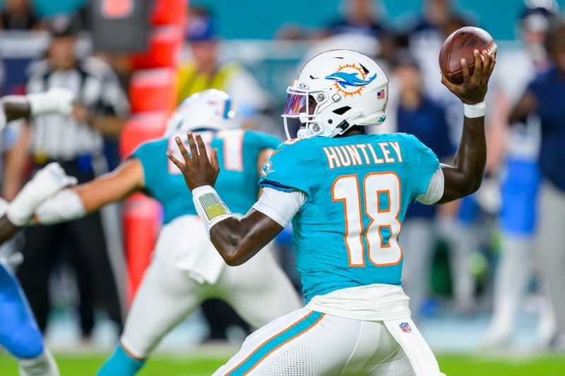 Miami Dolphins quarterback Tyler Huntley (18) throws the ball during an NFL football game against the Tennessee Titans, Monday, Sept. 30, 2024, in Miami Gardens, Fla. (AP Photo/Doug Murray)