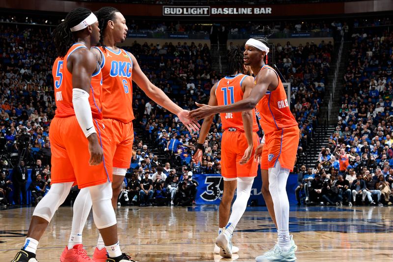 ORLANDO, FL - FEBRUARY 13: Jaylin Williams #6 and Shai Gilgeous-Alexander #2 of the Oklahoma City Thunder high five during the game against the Orlando Magic on February 13, 2024 at the Kia Center in Orlando, Florida. NOTE TO USER: User expressly acknowledges and agrees that, by downloading and or using this photograph, User is consenting to the terms and conditions of the Getty Images License Agreement. Mandatory Copyright Notice: Copyright 2024 NBAE (Photo by Fernando Medina/NBAE via Getty Images)