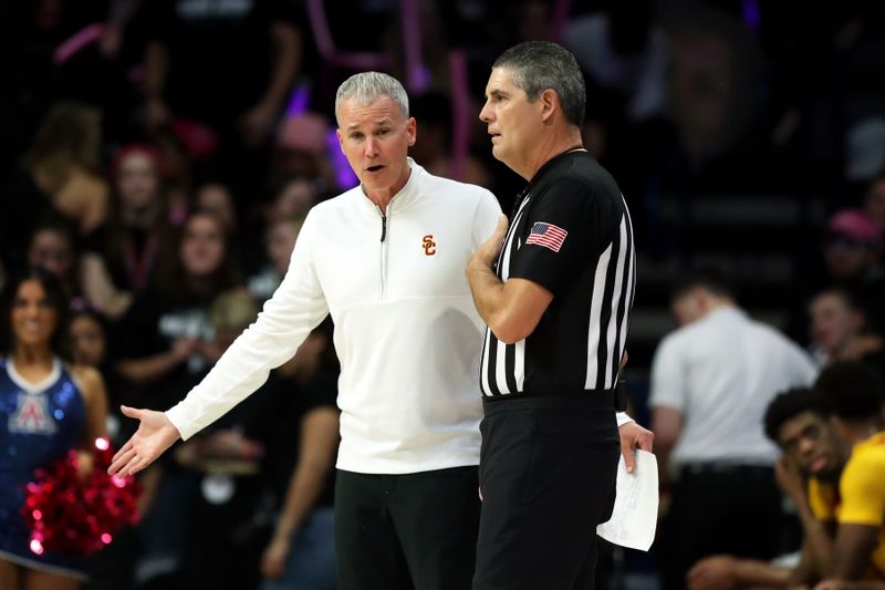 Jan 17, 2024; Tucson, Arizona, USA; USC Trojans head coach Andy Enfield talk to the referee on the sidelines against the Arizona Wildcats during the second half at McKale Center. Mandatory Credit: Zachary BonDurant-USA TODAY Sports