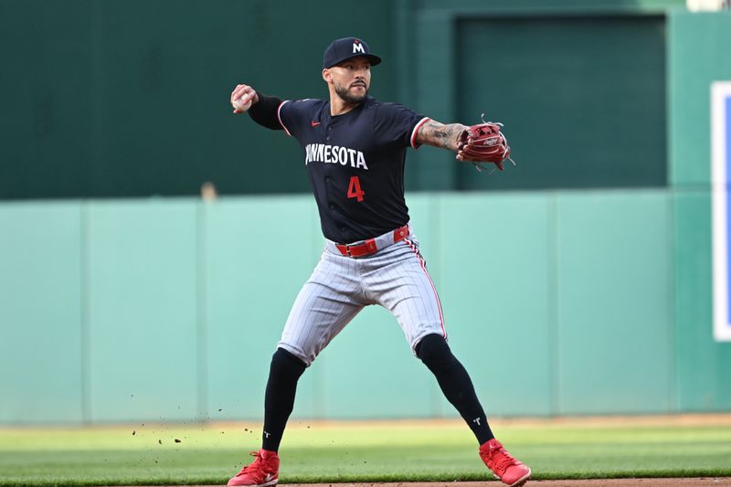 May 20, 2024; Washington, District of Columbia, USA; Minnesota Twins shortstop Carlos Correa (4) throws to first base after fielding a ground ball against the Washington Nationals during the first inning at Nationals Park. Mandatory Credit: Rafael Suanes-USA TODAY Sports