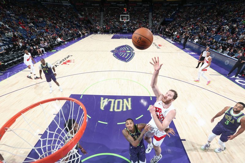 NEW ORLEANS, LA - NOVEMBER 27:  Jakob Poeltl #19 of the Toronto Raptors shoots the ball during the game against the New Orleans Pelicans during a regular season game on November 27, 2024 at the Smoothie King Center in New Orleans, Louisiana. NOTE TO USER: User expressly acknowledges and agrees that, by downloading and or using this Photograph, user is consenting to the terms and conditions of the Getty Images License Agreement. Mandatory Copyright Notice: Copyright 2024 NBAE (Photo by Layne Murdoch Jr./NBAE via Getty Images)