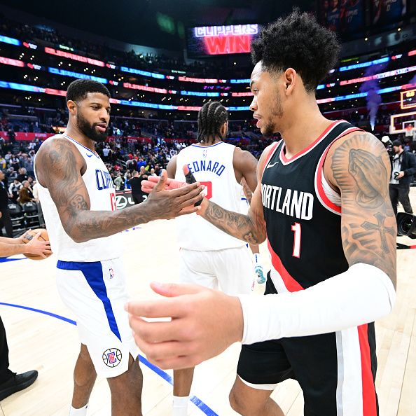 LOS ANGELES, CA - DECEMBER 11: Paul George #13 of the LA Clippers greets Anfernee Simons #1 of the Portland Trail Blazers after the game on December 11, 2023 at Crypto.Com Arena in Los Angeles, California. NOTE TO USER: User expressly acknowledges and agrees that, by downloading and/or using this Photograph, user is consenting to the terms and conditions of the Getty Images License Agreement. Mandatory Copyright Notice: Copyright 2023 NBAE (Photo by Adam Pantozzi/NBAE via Getty Images)