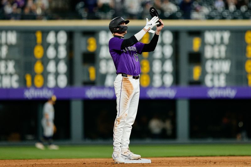 Apr 8, 2025; Denver, Colorado, USA; Colorado Rockies right fielder Zac Veen (13) reacts after reaching second base on a throwing error to first in the sixth inning against the Milwaukee Brewers at Coors Field. Mandatory Credit: Isaiah J. Downing-Imagn Images