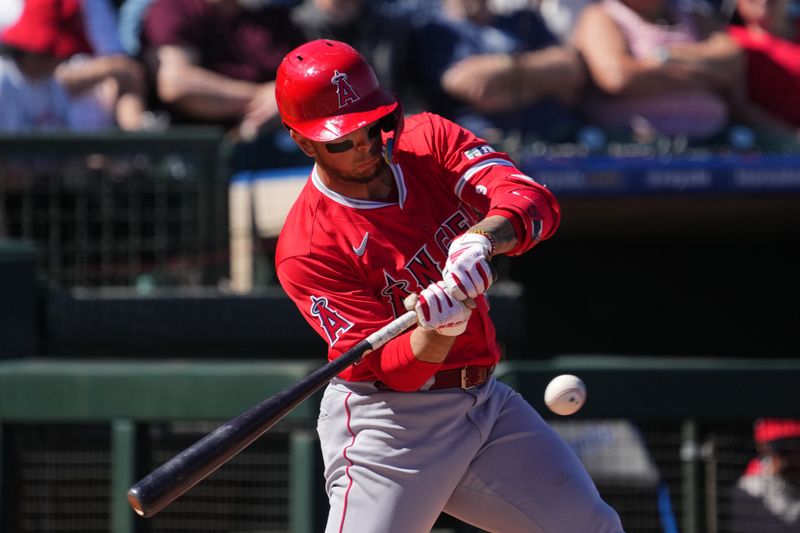 Mar 4, 2024; Surprise, Arizona, USA; Los Angeles Angels shortstop Zach Neto (9) bats against the Texas Rangers during the third inning at Surprise Stadium. Mandatory Credit: Joe Camporeale-USA TODAY Sports