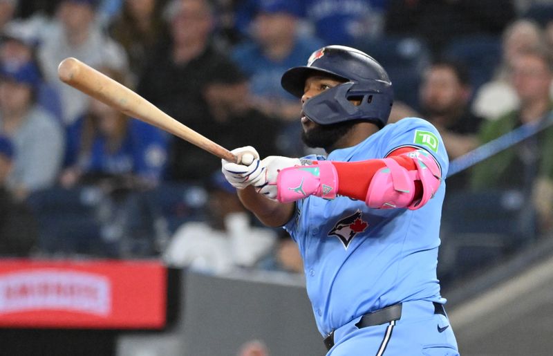 May 1, 2025; Toronto, Ontario, CAN;  Toronto Blue Jays first baseman Vladimir Guerrero Jr. (27) hits a three run home run against the Boston Red Sox in the eighth inning at Rogers Centre. Mandatory Credit: Dan Hamilton-Imagn Images