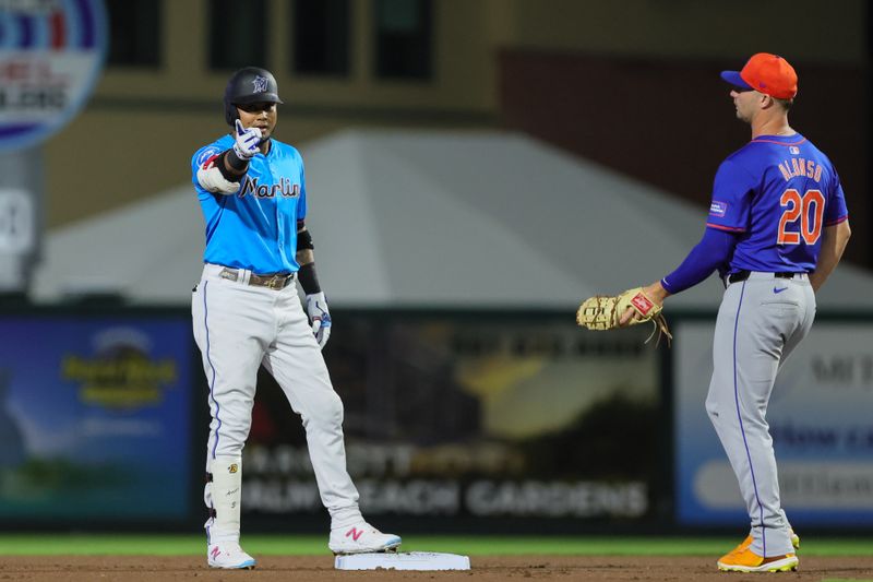 Mar 8, 2024; Jupiter, Florida, USA; Miami Marlins second baseman Luis Arraez (3) reacts after hitting a double against the New York Mets during the first inning at Roger Dean Chevrolet Stadium. Mandatory Credit: Sam Navarro-USA TODAY Sports