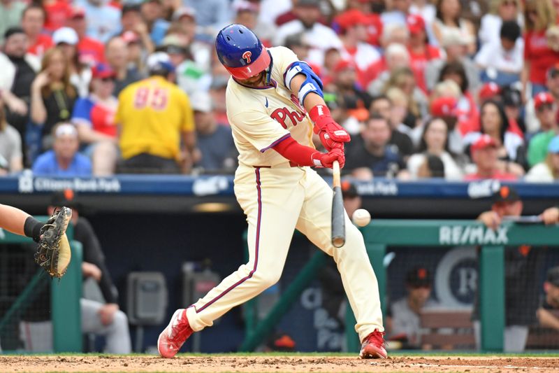 May 6, 2024; Philadelphia, Pennsylvania, USA; Philadelphia Phillies outfielder Nick Castellanos (8) hits an RBI single against the San Francisco Giants during the fourth inning at Citizens Bank Park. Mandatory Credit: Eric Hartline-USA TODAY Sports