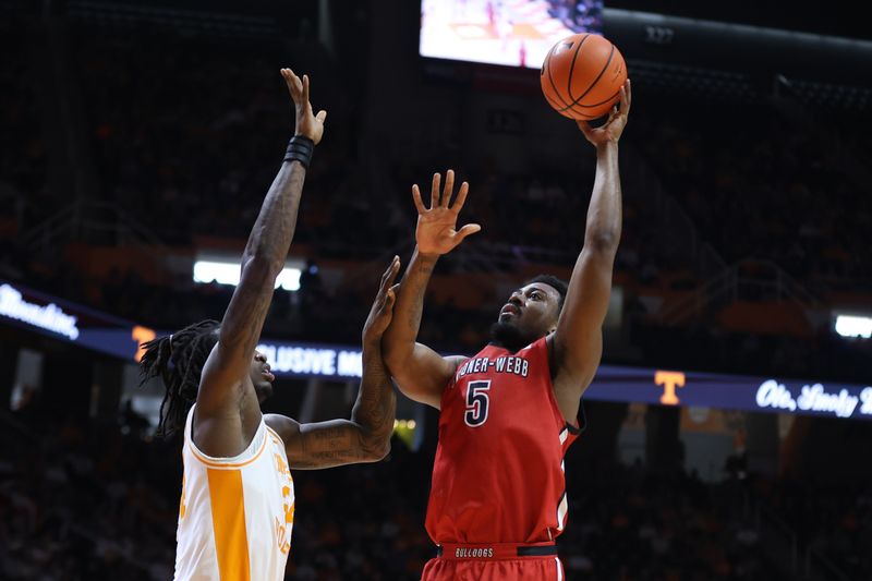 Dec 21, 2025; Knoxville, Tennessee, USA;  Gardner-Webb Runnin' Bulldogs forward Jacob Hogarth (5) goes to the basket against the Tennessee Volunteers during the second half at Thompson-Boling Arena at Food City Center. Mandatory Credit: Randy Sartin-Imagn Images