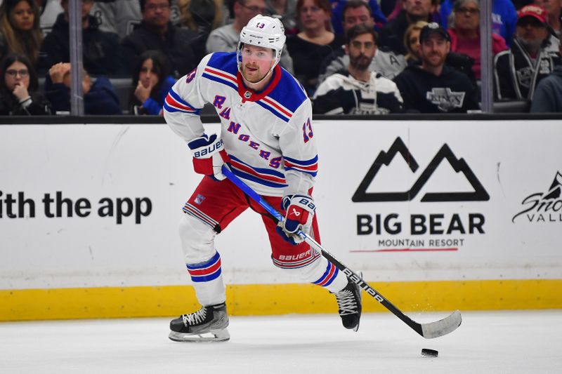 Jan 20, 2024; Los Angeles, California, USA; New York Rangers left wing Alexis Lafreniere (13) controls durng the third period at Crypto.com Arena. Mandatory Credit: Gary A. Vasquez-USA TODAY Sports