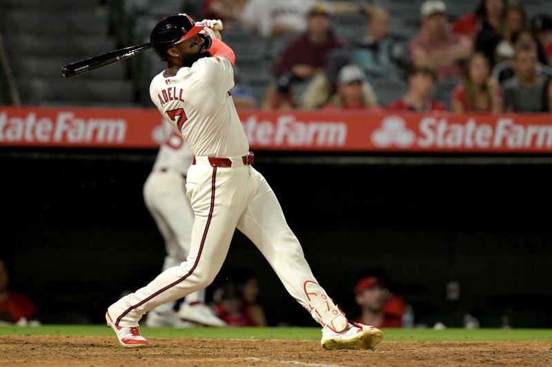 Jul 30, 2024; Anaheim, California, USA; Los Angeles Angels right fielder Jo Adell (7) hits a solo home run in the seventh inning against the Colorado Rockies at Angel Stadium. Mandatory Credit: Jayne Kamin-Oncea-USA TODAY Sports