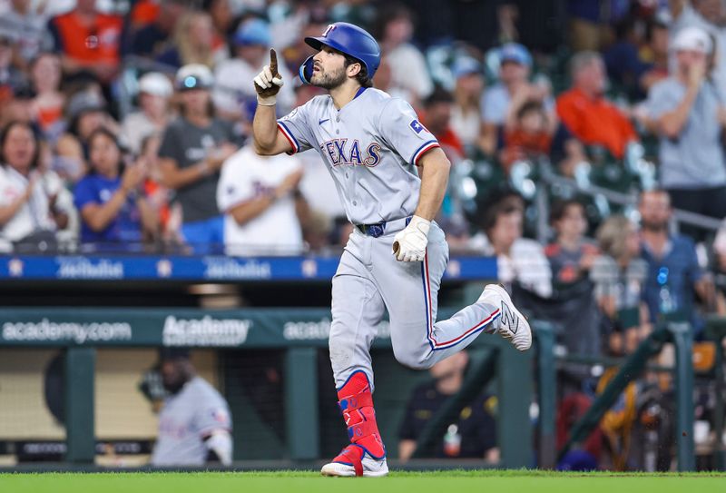 Jul 14, 2024; Houston, Texas, USA; Texas Rangers third baseman Josh Smith (8) rounds the bases after hitting a home run during the eighth inning against the Houston Astros at Minute Maid Park. Mandatory Credit: Troy Taormina-USA TODAY Sports