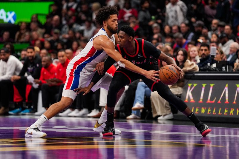 TORONTO, ON - NOVEMBER 15: Cade Cunningham #2 of the Detroit Pistons reaches for the ball against RJ Barrett #9 of the Toronto Raptors during the Emirates NBA Cup game at Scotiabank Arena on November 15, 2024 in Toronto, Ontario, Canada. NOTE TO USER: User expressly acknowledges and agrees that, by downloading and/or using this Photograph, user is consenting to the terms and conditions of the Getty Images License Agreement. (Photo by Andrew Lahodynskyj/Getty Images)