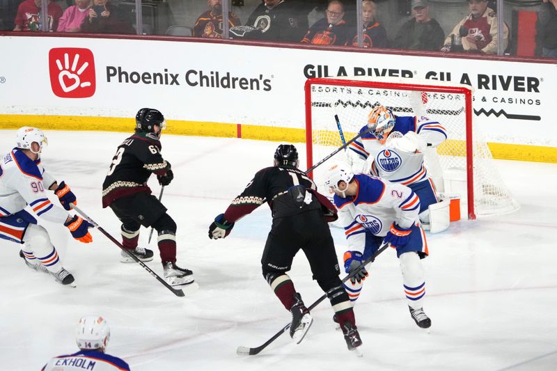 Feb 19, 2024; Tempe, Arizona, USA; Arizona Coyotes center Nick Bjugstad (17) scores against Edmonton Oilers goaltender Stuart Skinner (74) during the first period at Mullett Arena. Mandatory Credit: Joe Camporeale-USA TODAY Sports