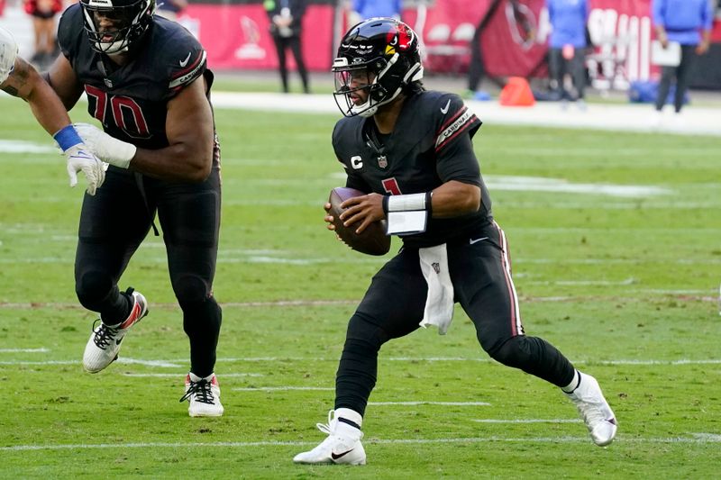 Arizona Cardinals quarterback Kyler Murray runs wit the ball against the Los Angeles Rams during the first half of an NFL football game Sunday, Nov. 26, 2023, in Glendale, Ariz. The Rams won 37-14. (AP Photo/Ross D. Franklin)